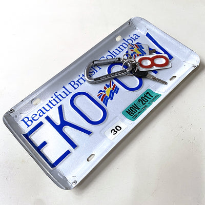 Tray for holding keys or coins that is made from a recycled BC license plate. Edges are bent and riveted in four corners to make its tray shape.